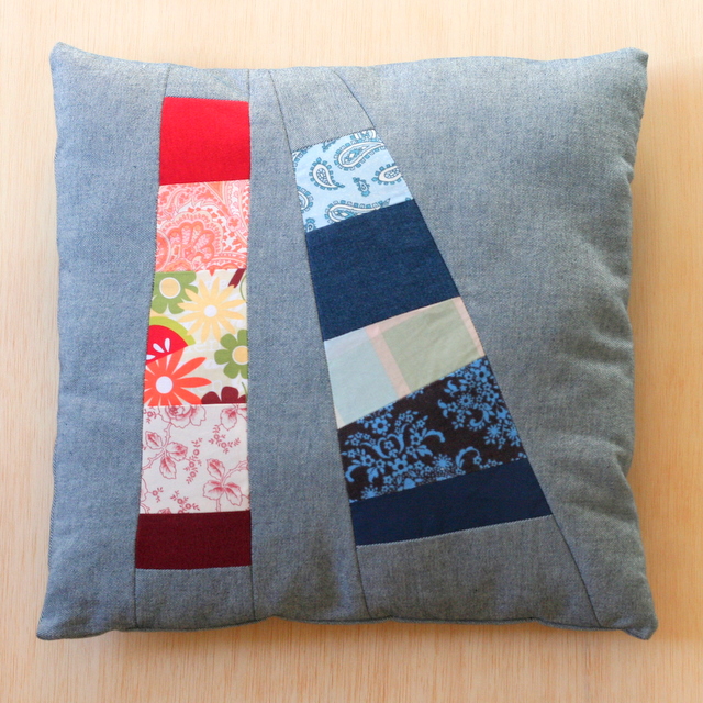 Finished denim patchwork pillow