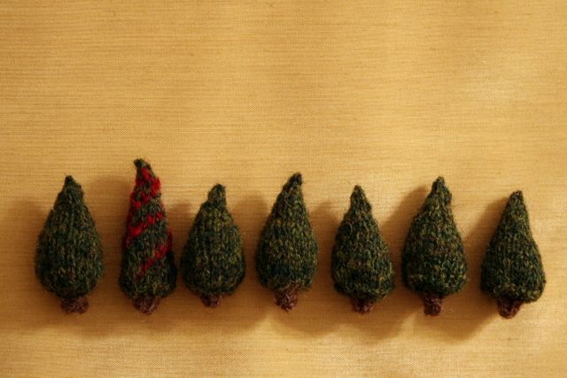 tiny knitted Christmas trees